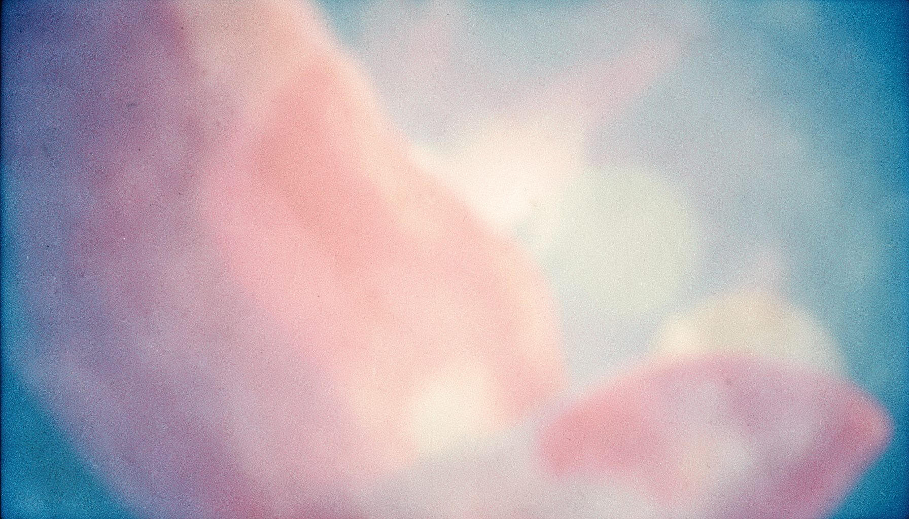 Soft pink and cream abstract organic shapes with a warm, gentle glow, evoking comfort and feminine care.